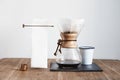 Coffee brewing method Chemex still life, barista stuff on stone board, wooden table. Package design template mockup