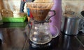 brewing coffee proces using coffee drip glass and jar with V60 paper filter Royalty Free Stock Photo