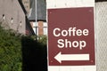 Coffee cafe shop direction arrow sign on wall