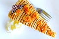 Coffee cake on the white plate and fork with soft blur whipped cream, Top view and close up Royalty Free Stock Photo