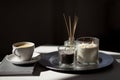 Coffee, candles and aroma reed diffuser on table