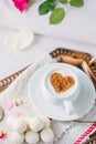 Coffee and candy in bed breakfast in hotel room. Royalty Free Stock Photo