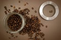 Coffee canister lid and coffee beans scattered on the table