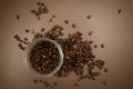 Coffee canister lid and coffee beans scattered on the table