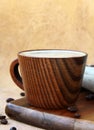 Coffee cappuccino in a stylish wooden cup Royalty Free Stock Photo