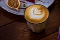 Coffee cappucino cup and cake on wood table classic style in cof Royalty Free Stock Photo