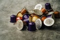 Coffee capsules, used Nespresso pods on table