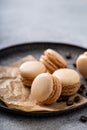 Coffee or chocolate macarons on a tray
