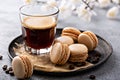 Coffee or chocolate macarons on a tray