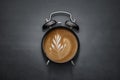 Coffee clock on dark concrete background