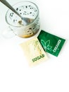 Coffee, coffee cup, Creamer sachets, sugar packets for breakfast Royalty Free Stock Photo