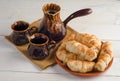 Coffee composition with croissants, set on wooden table