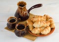 Coffee composition with croissants, set on wooden table