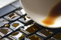Coffee on computer keyboard Royalty Free Stock Photo