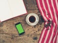 Coffee concept with cup, a book and a smart phone Royalty Free Stock Photo