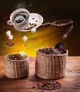 Coffee concept image. Cup of coffee with sugar cubes and coffee beans  flying in the air Royalty Free Stock Photo