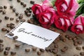 Coffee concept. roses and coffee. cup of coffee and a bouquet of roses on a wooden table. morning coffee and note. copy spaces. Royalty Free Stock Photo