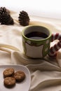 Coffee and Cookies for Santa Clause for Christmas. Plate of cookies on the bed with Christmas pinecones. Large well in green and r Royalty Free Stock Photo