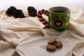 Coffee and Cookies for Santa Clause for Christmas. Plate of cookies on the bed with Christmas pinecones. Large well in green and r Royalty Free Stock Photo