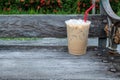 Coffee cool moment the sun is low. On a wooden chair in the park Royalty Free Stock Photo