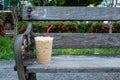 Coffee cool moment the sun is low. On a wooden chair in the park Royalty Free Stock Photo