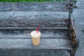 Coffee cool moment the sun is low. On a wooden chair in the park Royalty Free Stock Photo