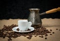 Coffee copper and white cup. Greek coffee with water and coffee pot. Turkish coffee and beans.