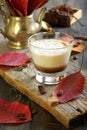 Coffee cortado and autumn leaves.