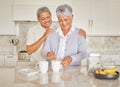 Coffee, couple and love with a senior woman and man enjoying retirement while together in the kitchen of their home Royalty Free Stock Photo