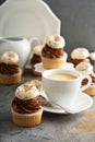 Coffee and cream cupcakes decorated with donuts