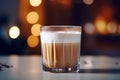 Coffee with cream in a glass, a tasty breakfast treat