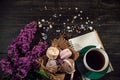 Coffee and cream macarons with cup of coffee