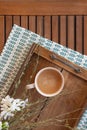 Coffee with Creamer Cup on wooden table with flowers