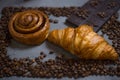 Coffee croissant chocolate breakfast arranged on a gray stone background top view. Photo in a low frame of coffee beans on a gr