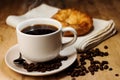 Coffee,croissant and coffee bean on wooden table Royalty Free Stock Photo