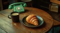 Vintage Telephone Coffee with Croissant on Wooden Table Royalty Free Stock Photo