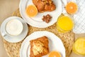 Coffee with croissants, pieces of chocolate, orange juice and tangerines for breakfast Royalty Free Stock Photo