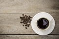 White cup of black coffee on wooden table background. Top view, Royalty Free Stock Photo