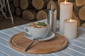 Coffee cup on bar table and romantic candles closeup Royalty Free Stock Photo