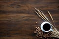 Coffee cup and coffee bean on wood desk