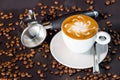 Coffee cup and beans on a black background.