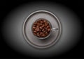 Coffee cup and beans on black color background, top view Royalty Free Stock Photo