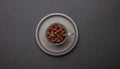 Coffee cup and beans on black color background, top view Royalty Free Stock Photo