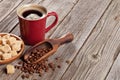 Coffee cup, beans and brown sugar on wooden table Royalty Free Stock Photo