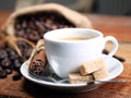 Coffee cup with Coffee beans, burlap sack and with cinnamon sticks Royalty Free Stock Photo