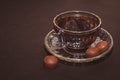 Coffee cup, beans, chocolate and macaroons on old kitchen table. Top view Royalty Free Stock Photo