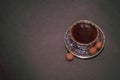 Coffee cup, beans, chocolate and macaroons on old kitchen table. Top view Royalty Free Stock Photo