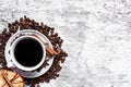 Coffee cup and beans, cinnamon sticks, cokcies and anise Royalty Free Stock Photo