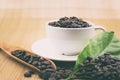 Coffee cup with coffee beans and coffee leaves Royalty Free Stock Photo