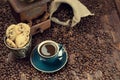 Coffee cup, beans and old grinder Royalty Free Stock Photo